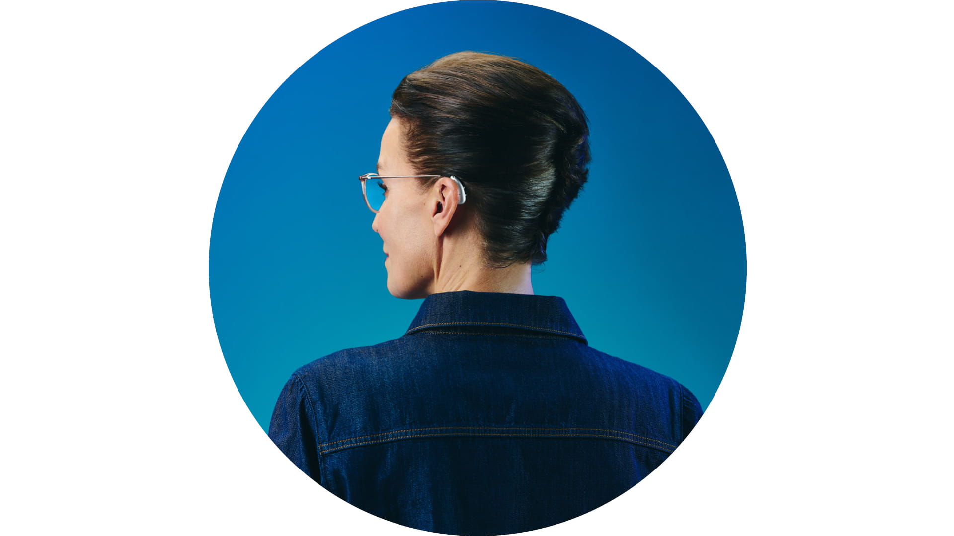 Woman wearing Pure Charge&Go BCT IX hearing aids