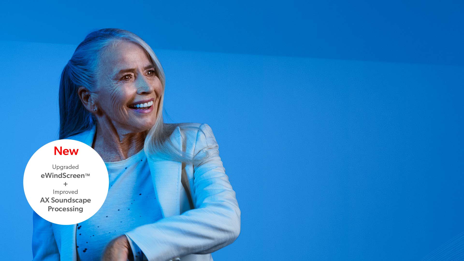 Woman wearing Pure Charge&Go AX hearing aids