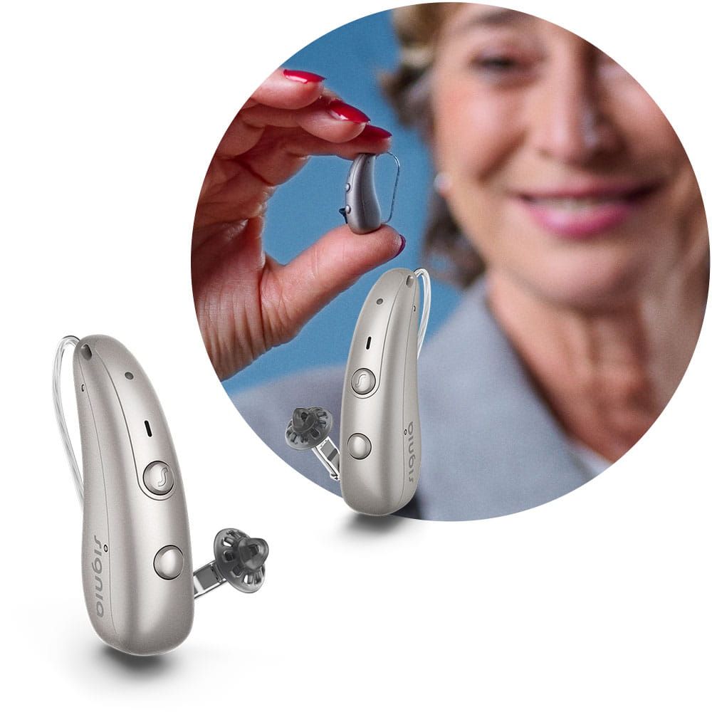 Woman holding Pure Charge&Go BCT IX hearing aid