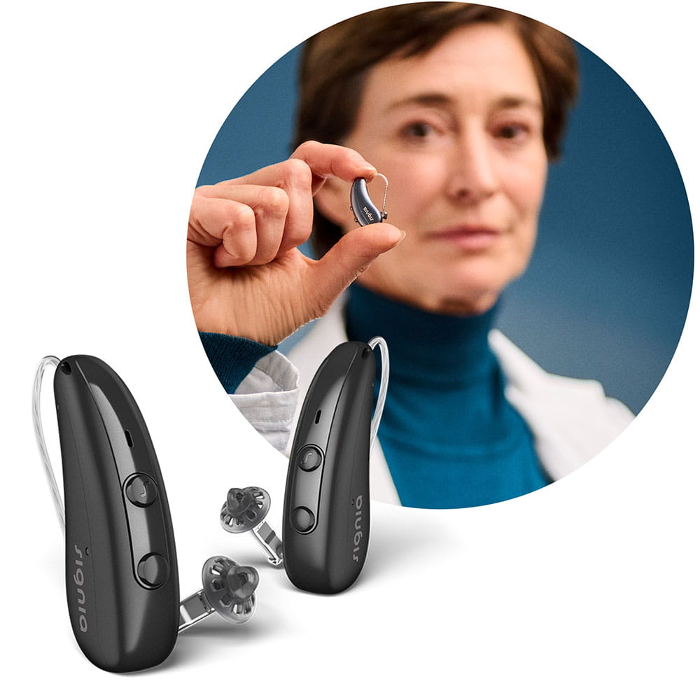 Woman holding Pure Charge&Go IX hearing aid