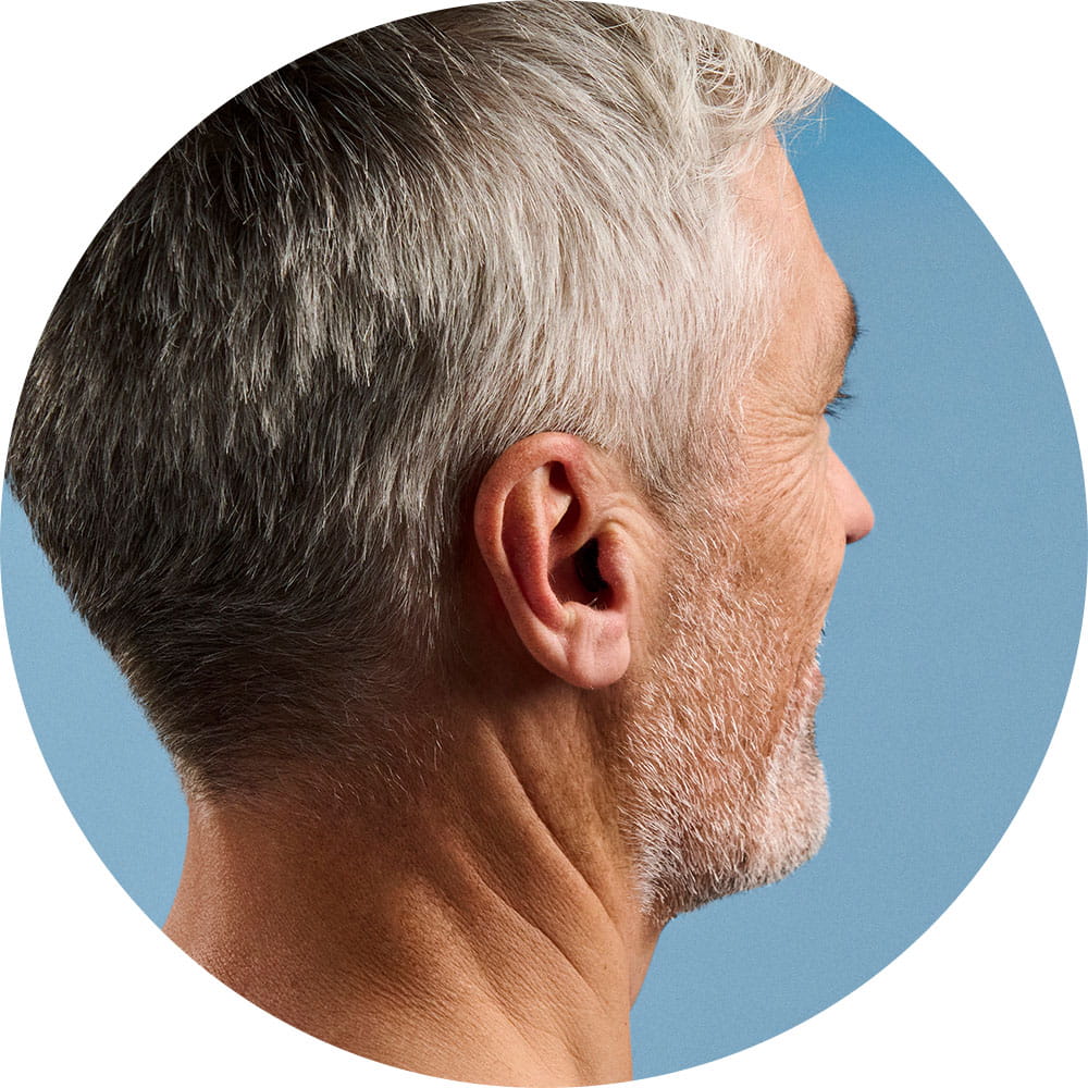 Portait of a man wearing Silk Charge&Go IX hearing aids