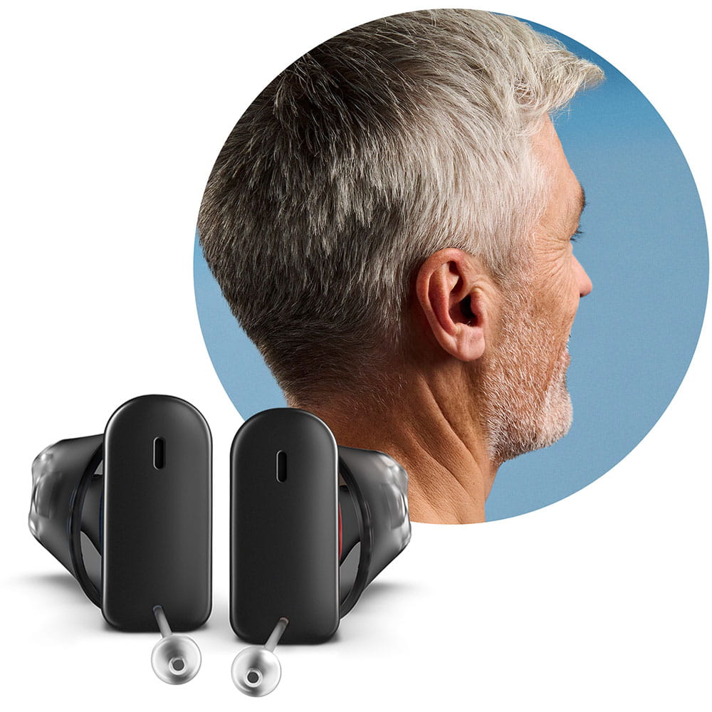 Portait of a man wearing Silk Charge&Go IX hearing aids