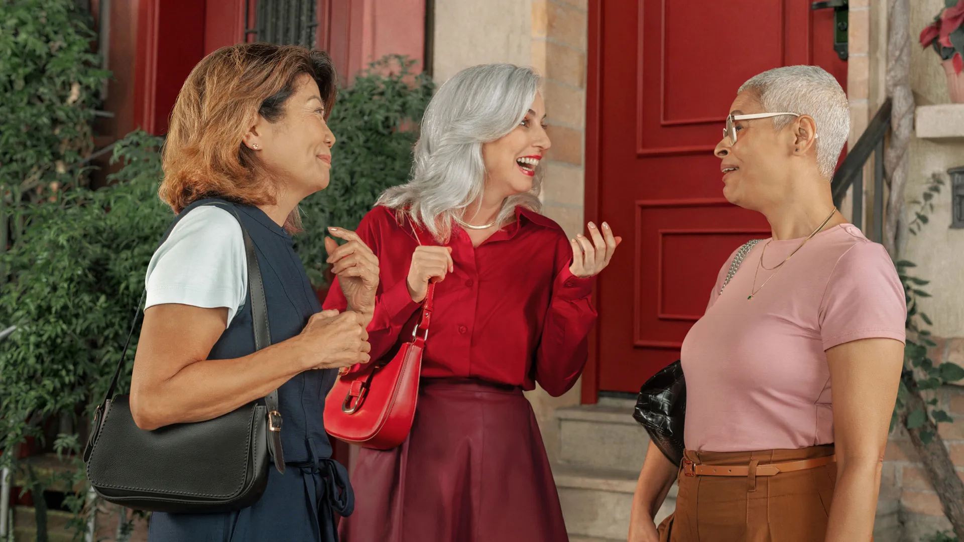 Friends laughing together in Signia's MaX group-conversation campaign