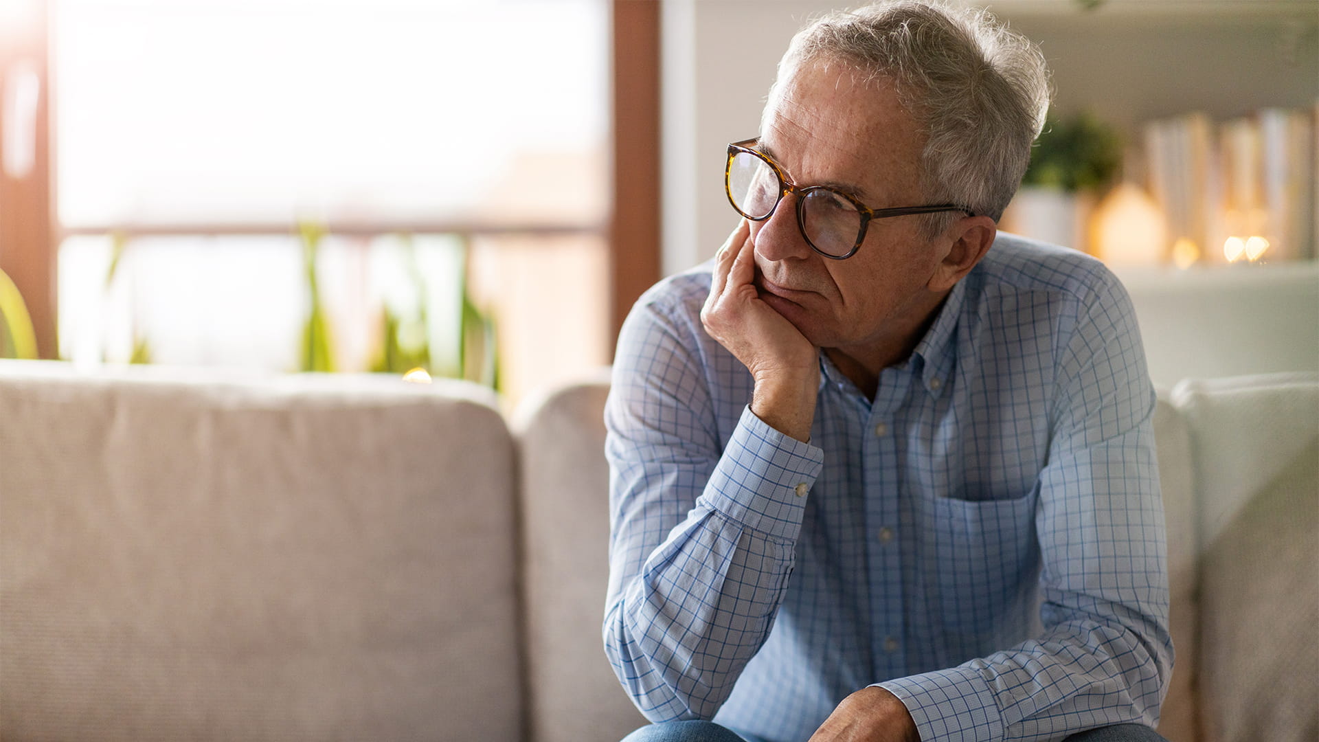 older man looking sad; depression and hearing aid blog